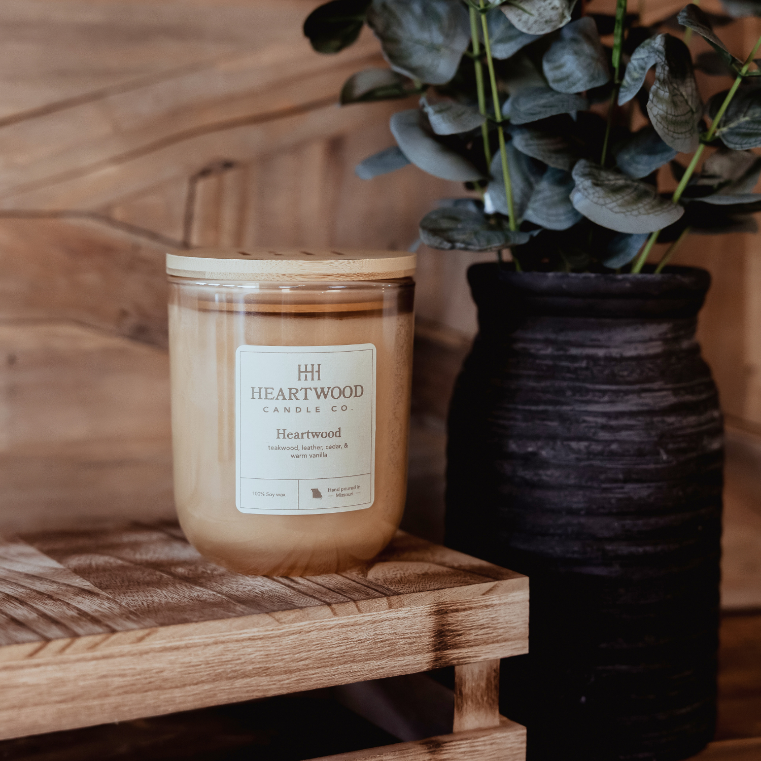 Hand-poured soy candle in a reusable glass jar with wooden lid